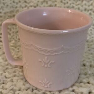 Skye McGhie child’s  pink mug, 2.75 inches tall.